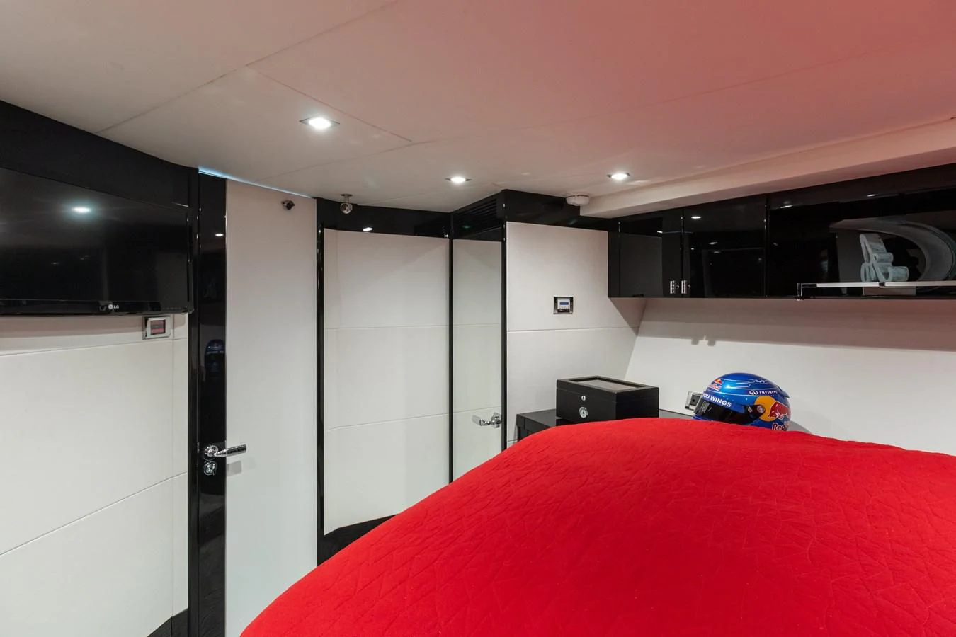 a room with a red bed and white walls aboard ASHLEY Yacht for Sale