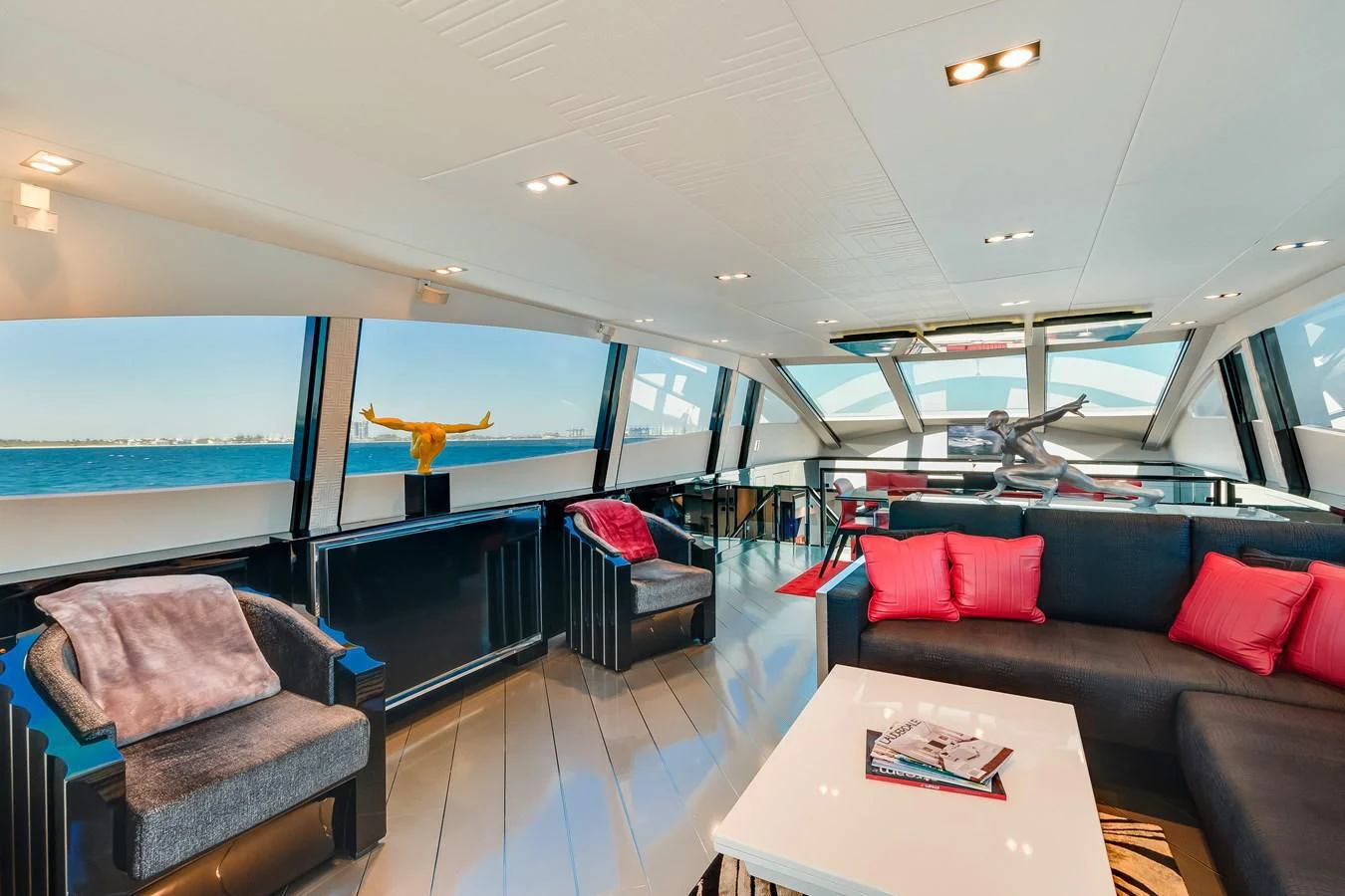 a room with a couch and a table and a window aboard ASHLEY Yacht for Sale