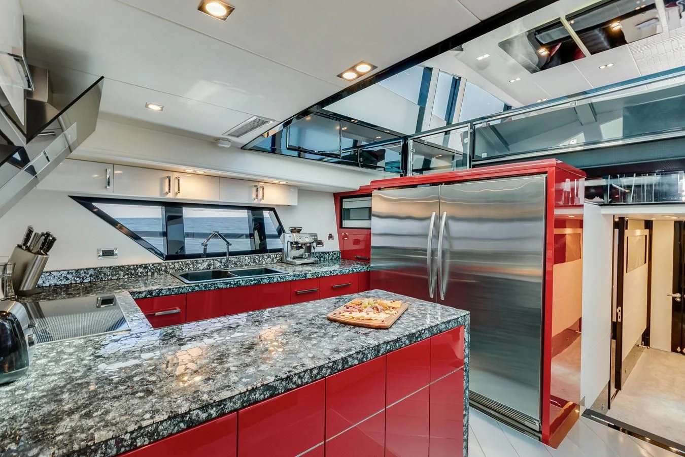 a kitchen with a pizza on the counter aboard ASHLEY Yacht for Sale