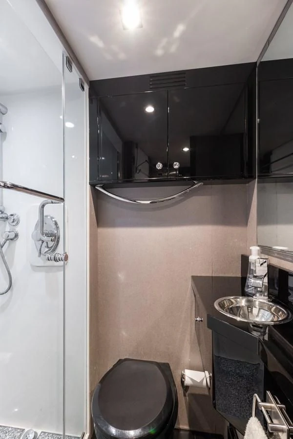 a bathroom with a sink and a mirror aboard ASHLEY Yacht for Sale