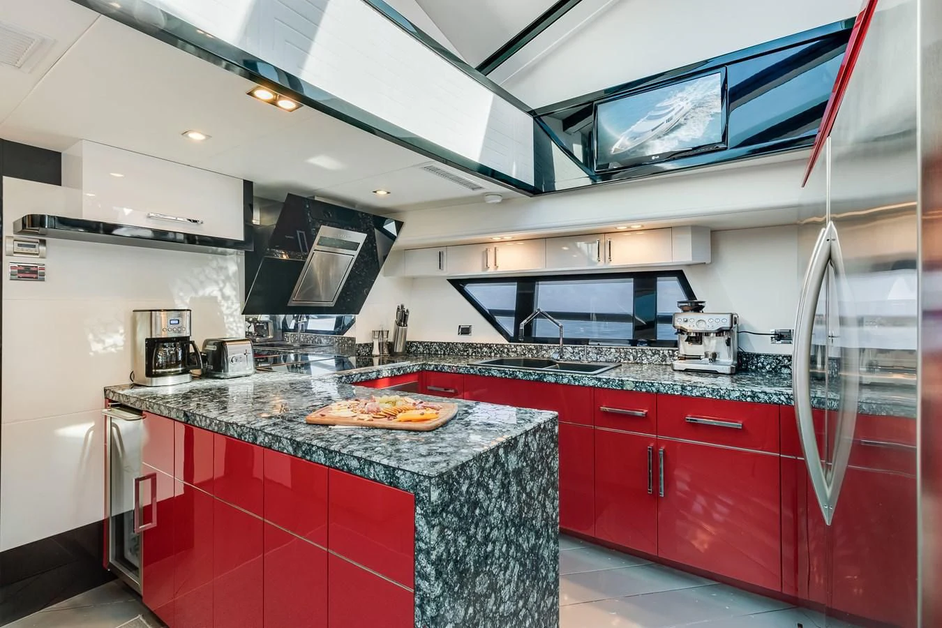 a kitchen with red cabinets aboard ASHLEY Yacht for Sale
