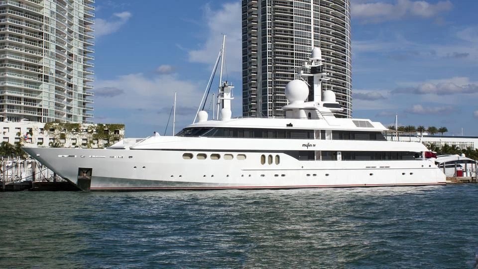 a large white boat in the water aboard MYLIN IV Yacht for Sale