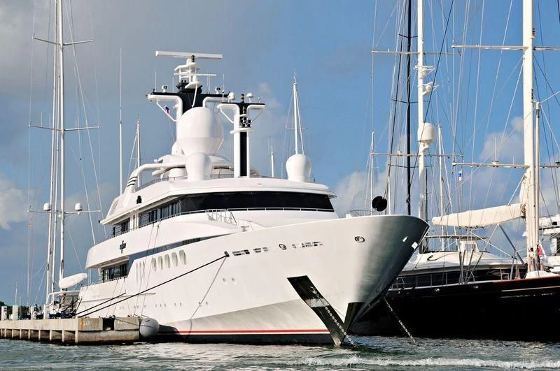 a large white boat in the water aboard MYLIN IV Yacht for Sale