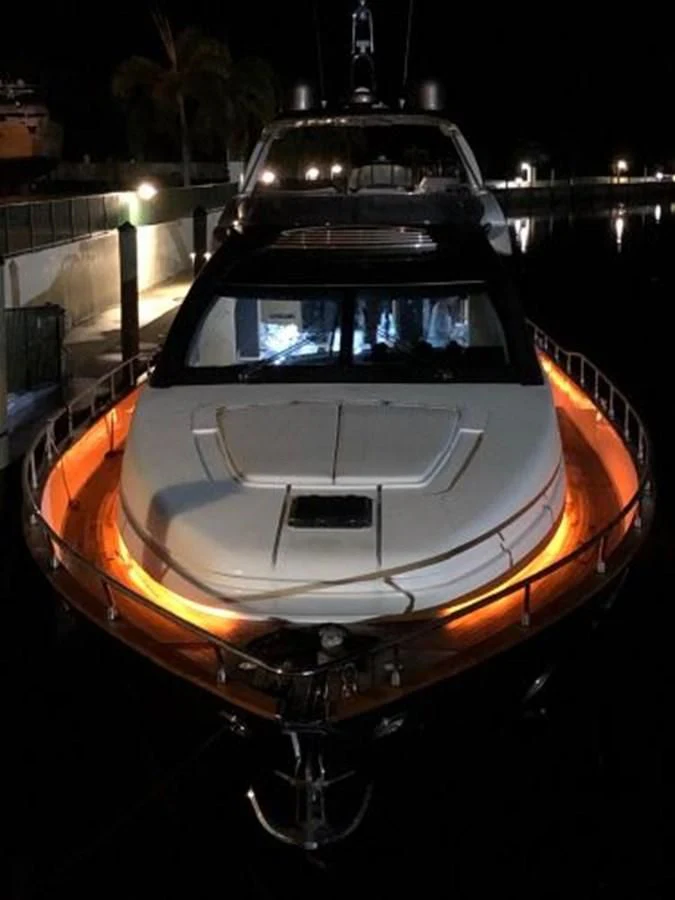 a car with its lights on aboard 2013 RIVA 75 VENERE SUPER Yacht for Sale