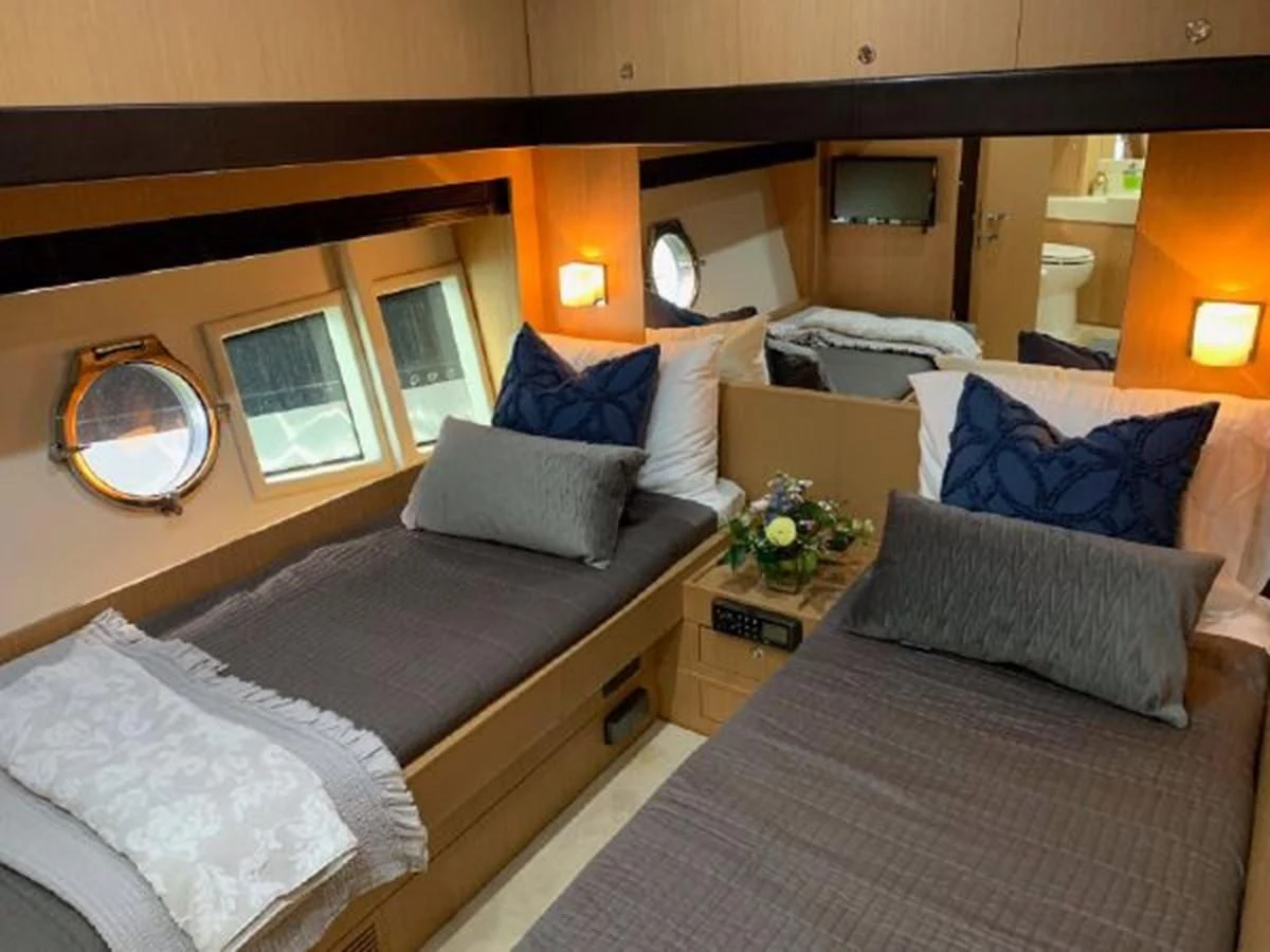 a room with a bed and a mirror aboard 2013 RIVA 75 VENERE SUPER Yacht for Sale