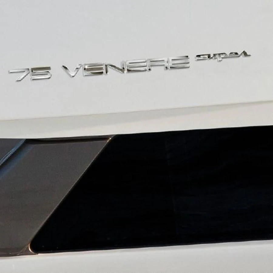 a white keyboard with a black rectangular object on it aboard 2013 RIVA 75 VENERE SUPER Yacht for Sale
