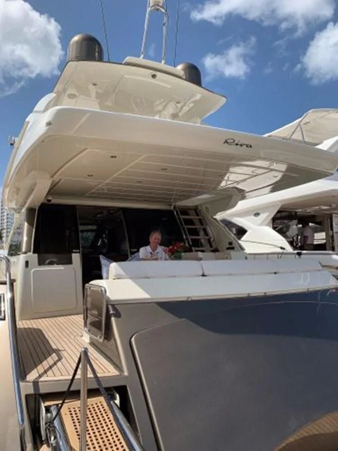 a person sitting in a boat aboard 2013 RIVA 75 VENERE SUPER Yacht for Sale