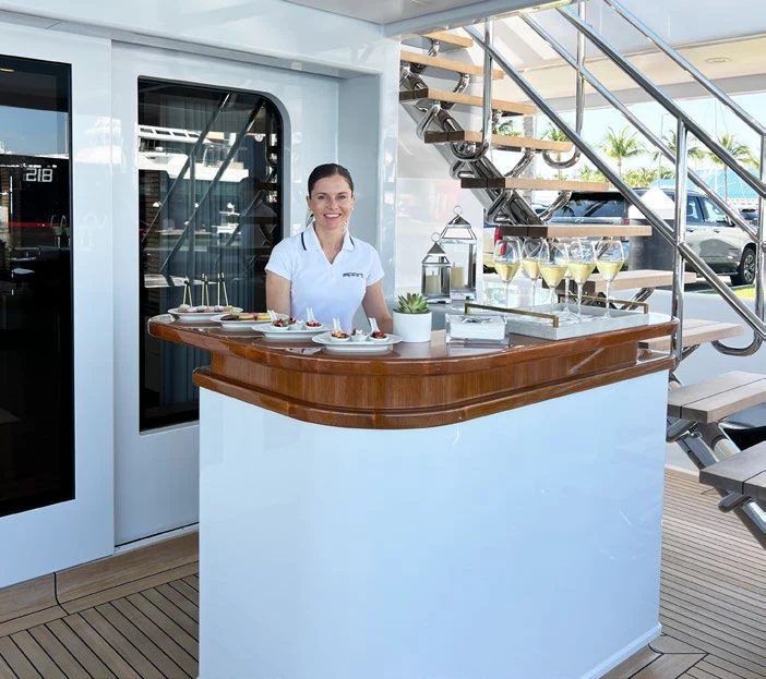 a man standing behind a counter aboard SPORT Yacht for Sale