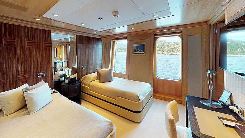 a room with a bed and a desk aboard SPORT Yacht for Sale