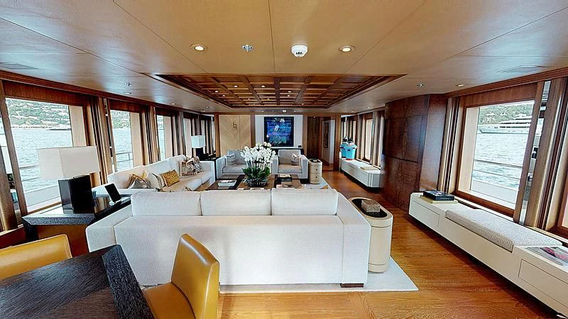 a living room with a couch and a television aboard SPORT Yacht for Sale