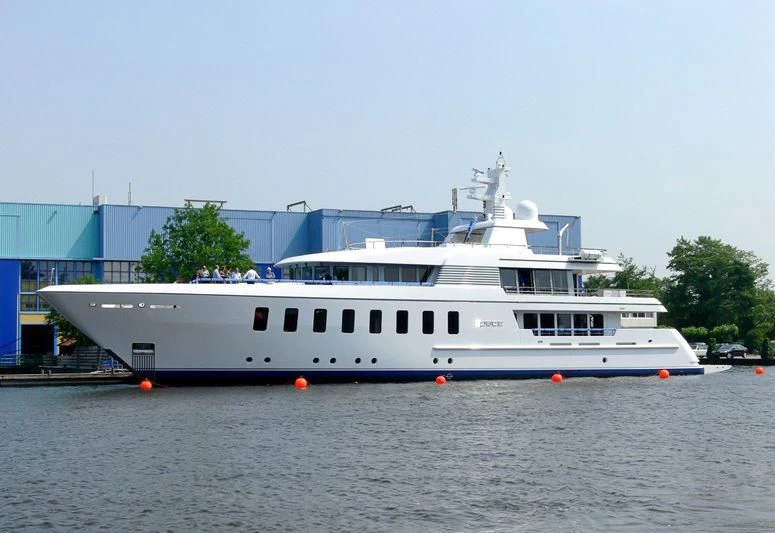a large white boat in a harbor aboard SPORT Yacht for Sale