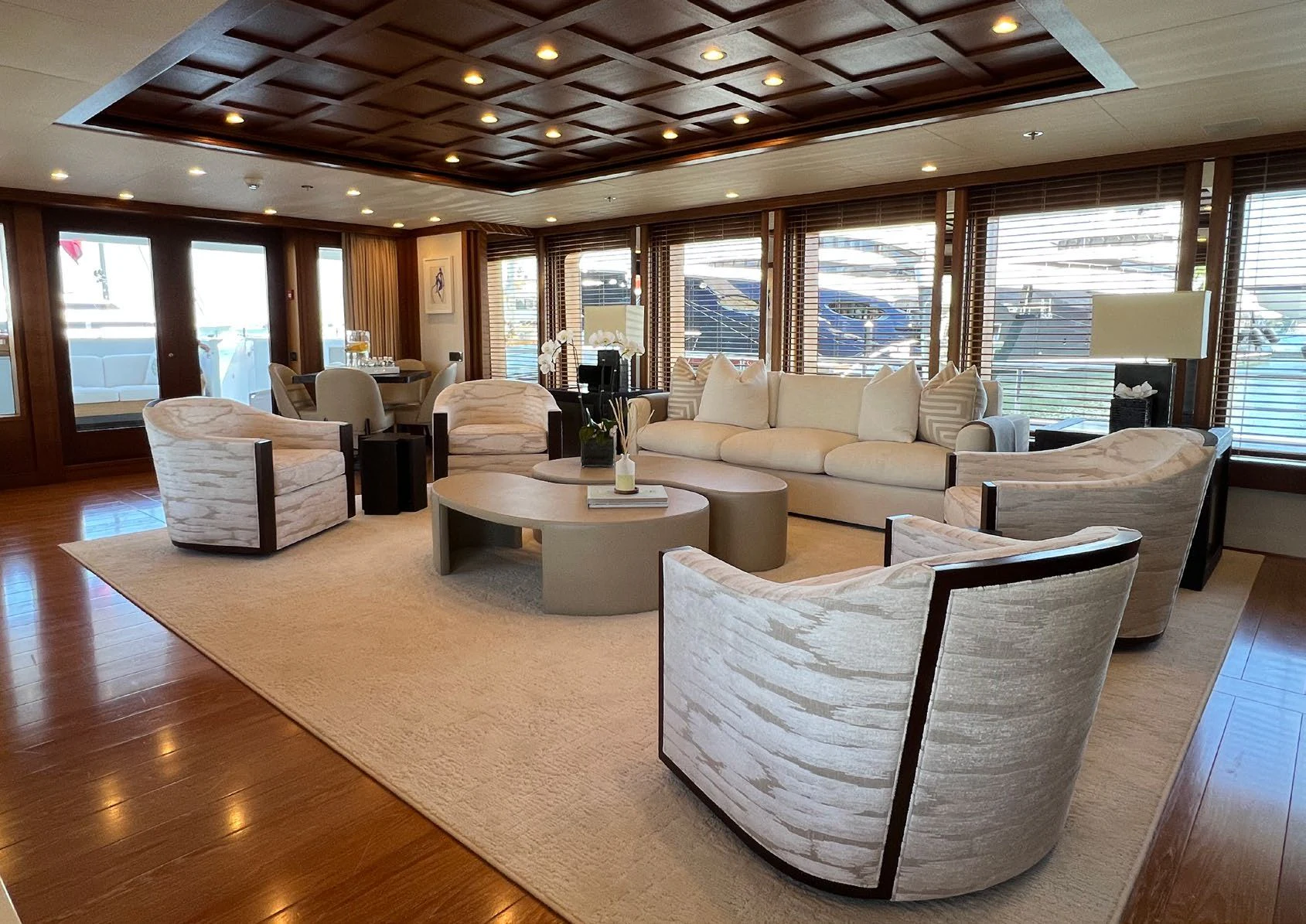 a large living room with a large wood floor aboard SPORT Yacht for Sale