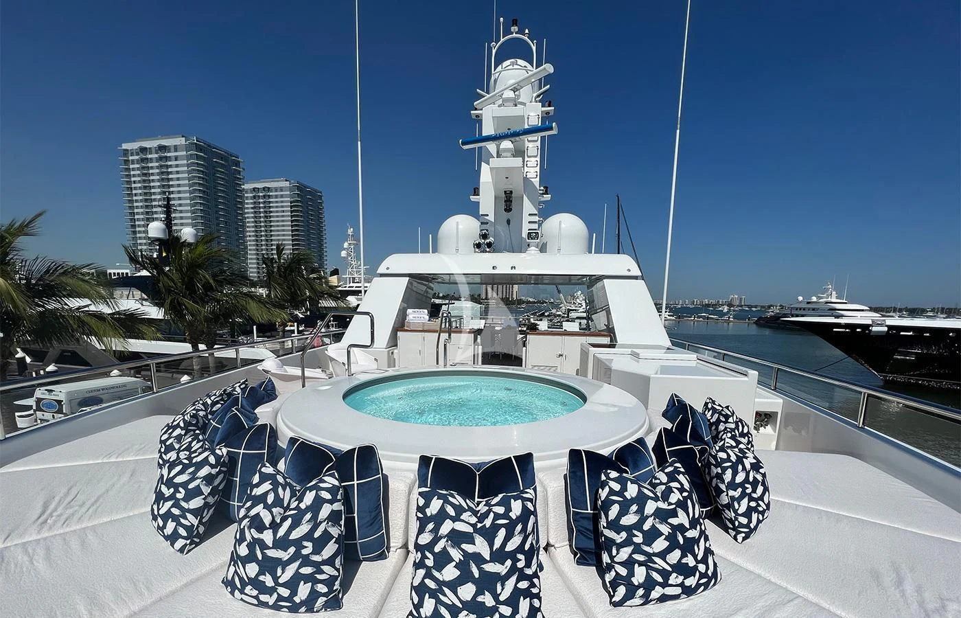 a white building with a blue roof and a white tower with a blue roof and a white dome aboard SPORT Yacht for Sale
