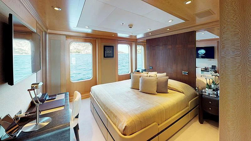 a room with a bed and a desk aboard SPORT Yacht for Sale