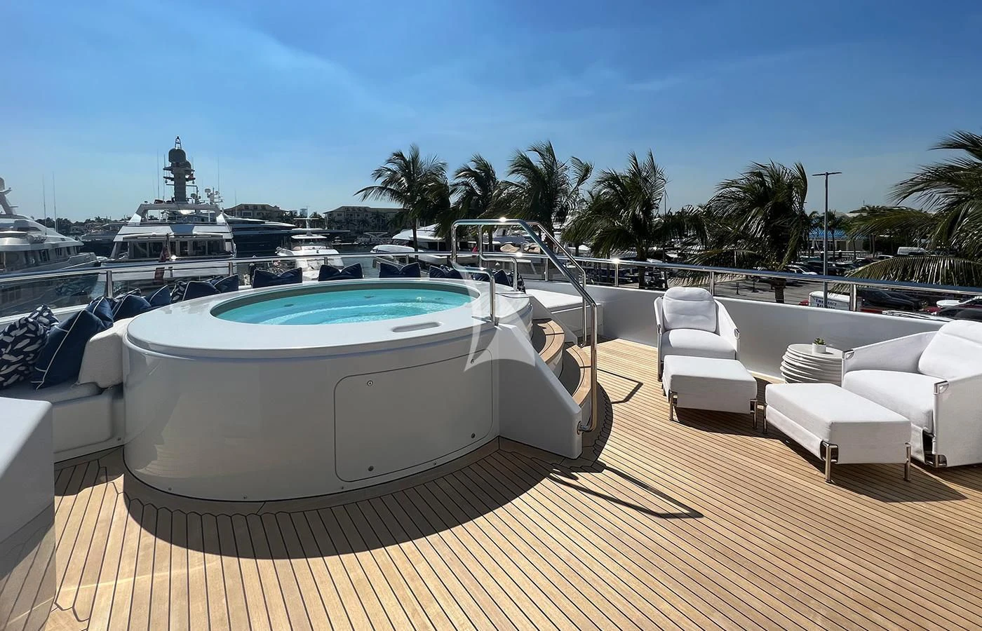 a pool with a table and chairs aboard SPORT Yacht for Sale