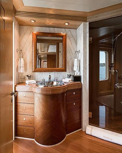 a bathroom with a sink and a mirror aboard SPORT Yacht for Sale