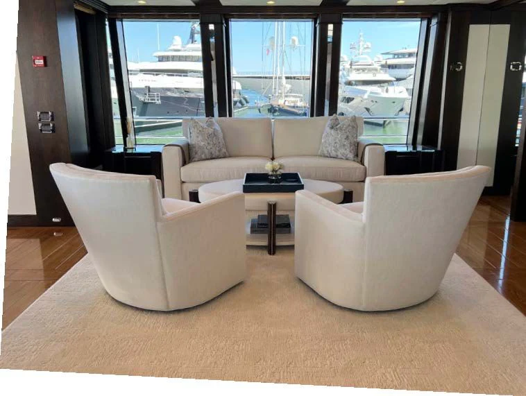 a room with couches and a table aboard SPORT Yacht for Sale