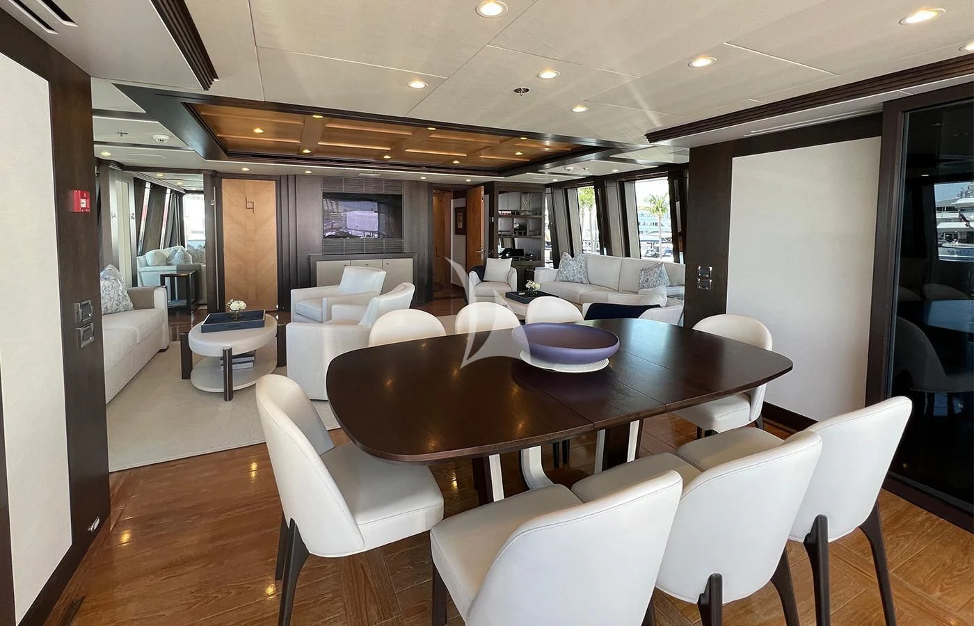 a large dining table in a living room aboard SPORT Yacht for Sale