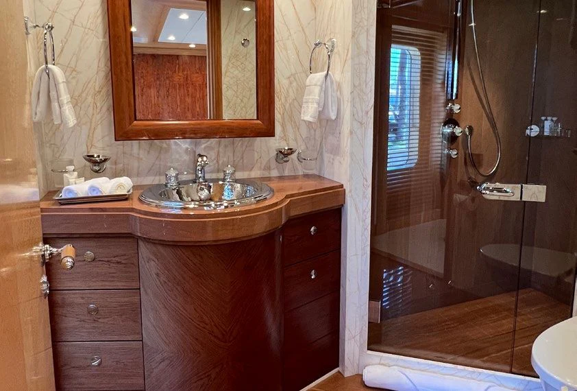 a bathroom with a sink and a mirror aboard SPORT Yacht for Sale