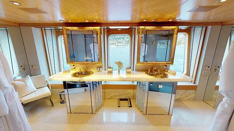 a room with a table and chairs aboard SPORT Yacht for Sale