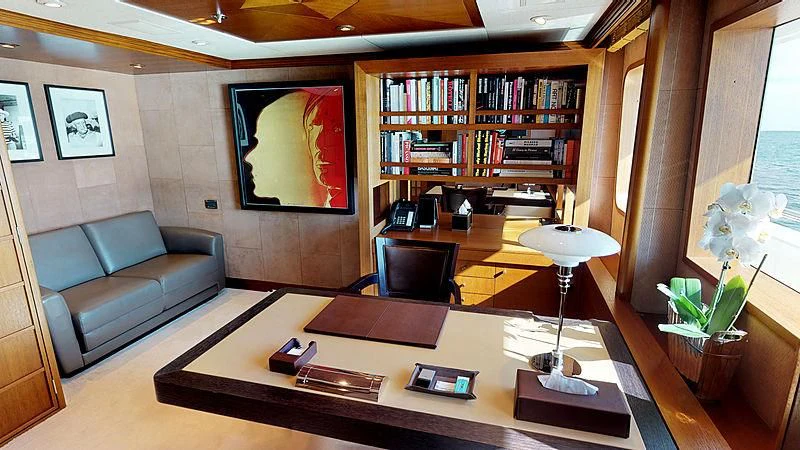 a living room with a couch and a coffee table aboard SPORT Yacht for Sale