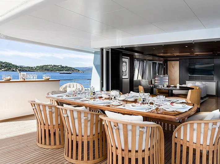 a dining table set for a meal aboard SPORT Yacht for Sale