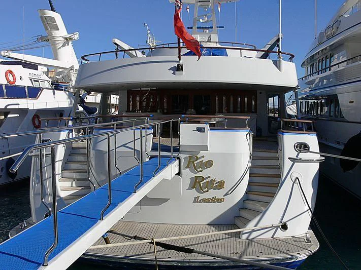 a boat docked at a pier aboard RIO RITA Yacht for Sale