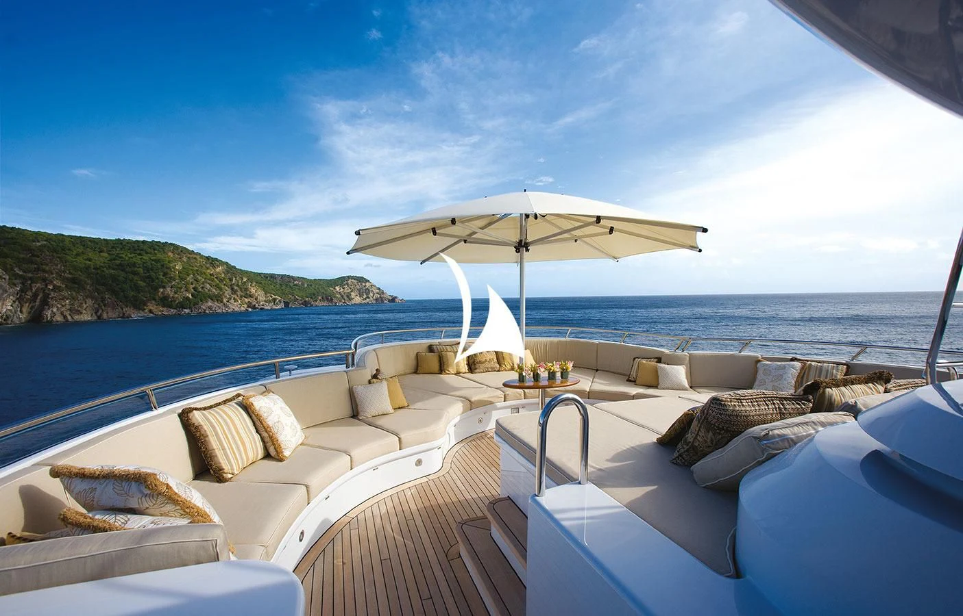 a lounge area with a large umbrella aboard UTOPIA Yacht for Sale
