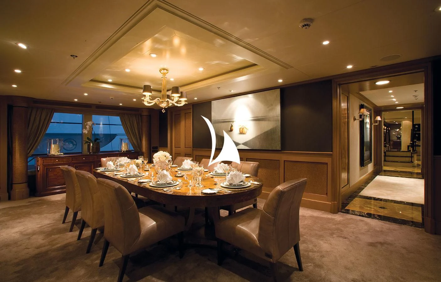 a large dining room with a large table and chairs aboard UTOPIA Yacht for Sale