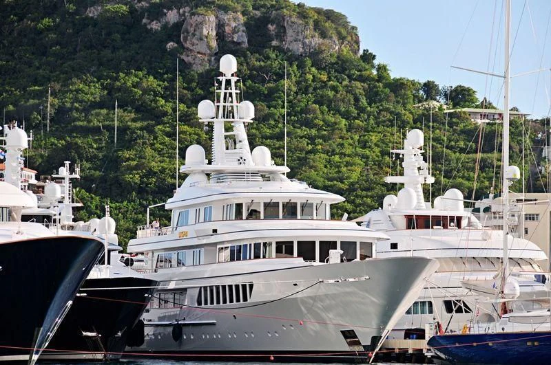 a group of boats are parked in a harbor aboard UTOPIA Yacht for Sale