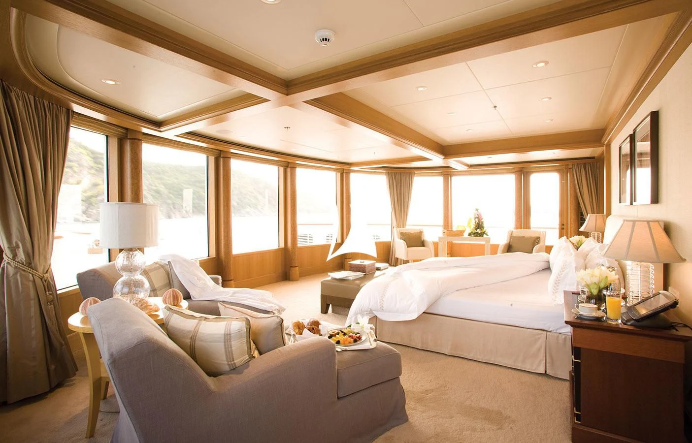 a room with a bed and a couch aboard UTOPIA Yacht for Sale