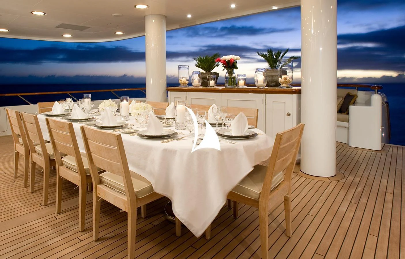 a table set for a dinner aboard UTOPIA Yacht for Sale