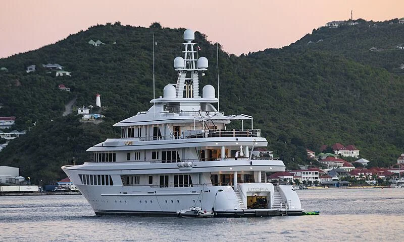 a large white ship on the water aboard UTOPIA Yacht for Sale