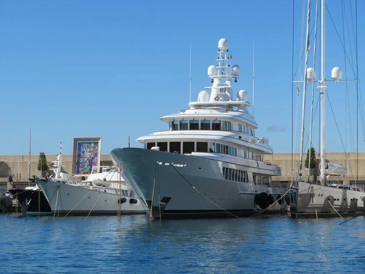 a large white boat in the water aboard UTOPIA Yacht for Sale
