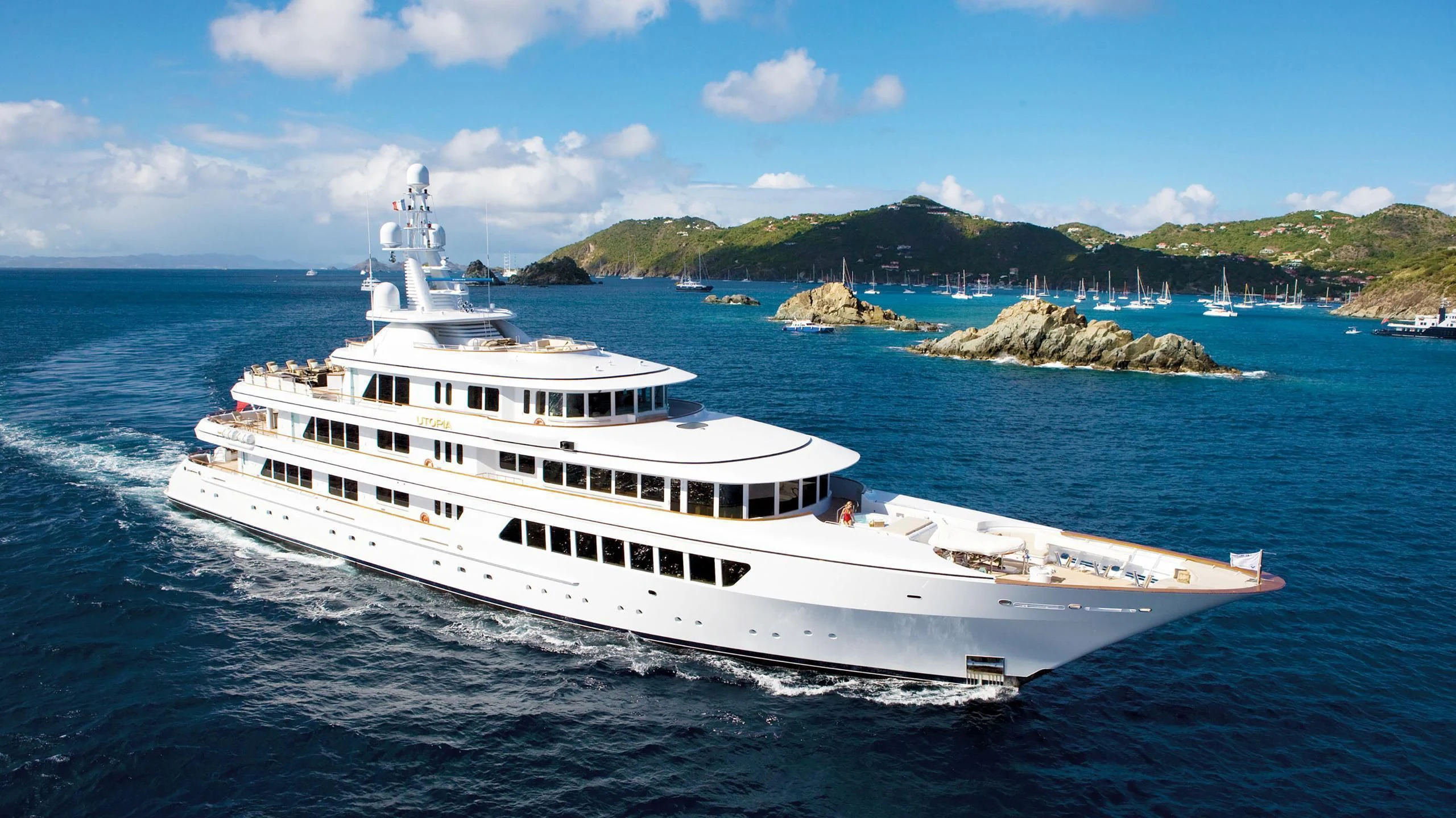 a white yacht on the water aboard UTOPIA Yacht for Sale