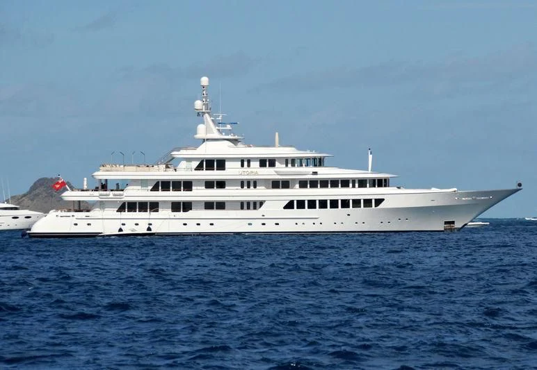 a large white boat in the water aboard UTOPIA Yacht for Sale