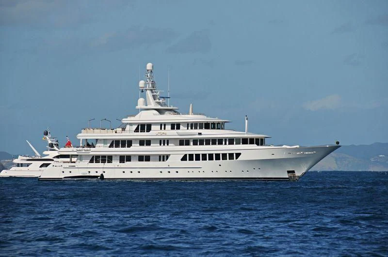 a large white boat in the water aboard UTOPIA Yacht for Sale