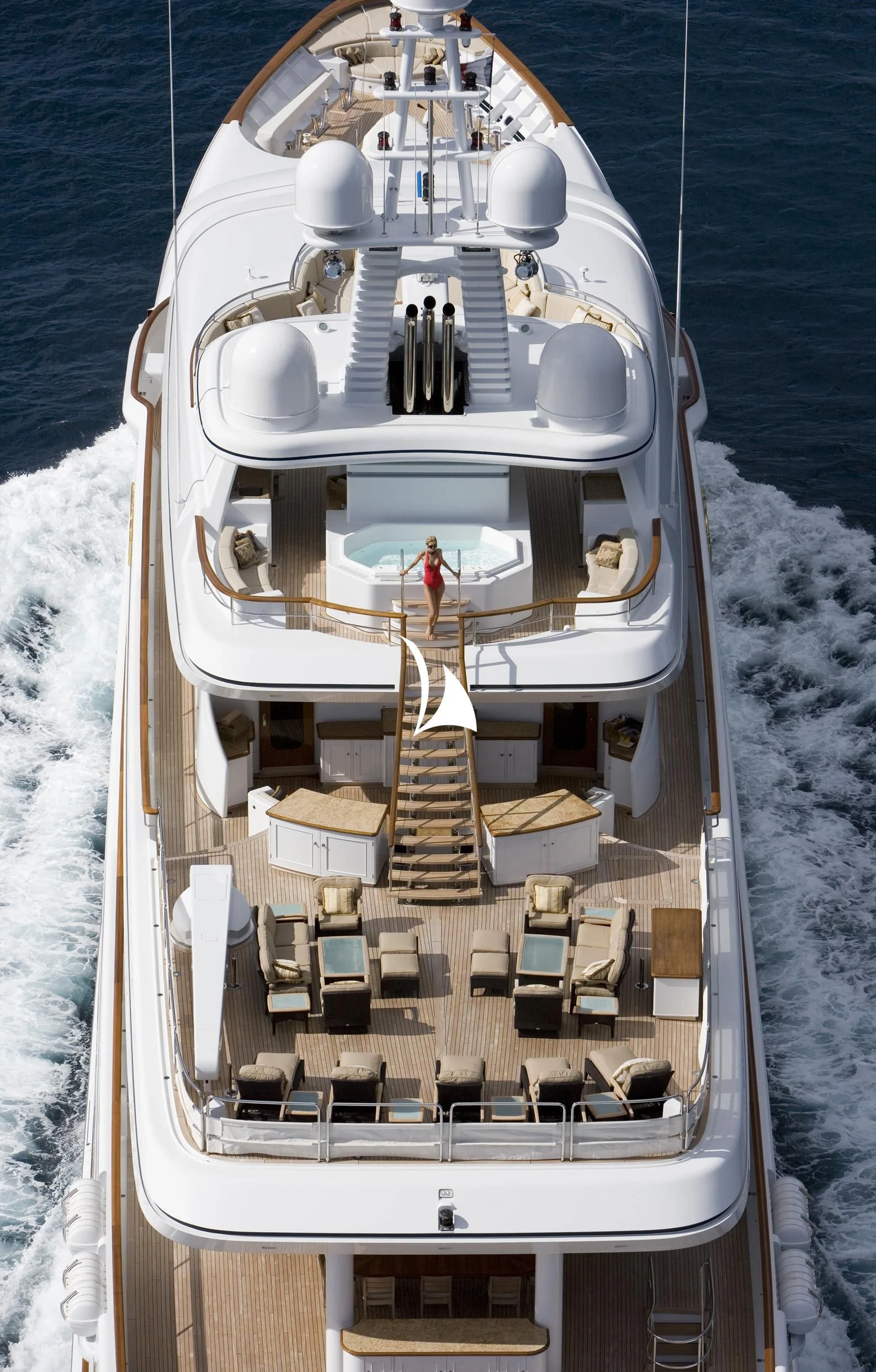 a large ship with a person standing on the deck aboard UTOPIA Yacht for Sale