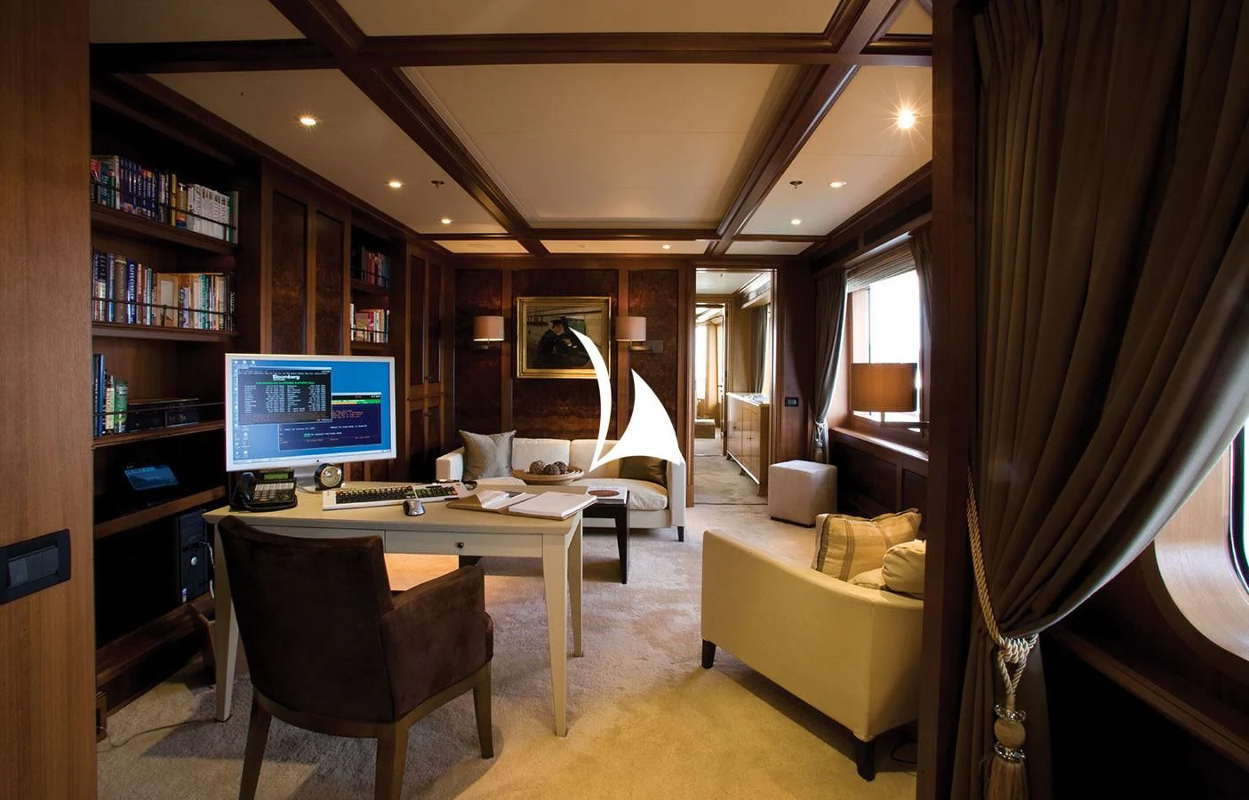 a room with a desk and a tv aboard UTOPIA Yacht for Sale