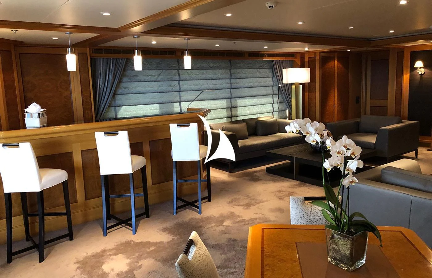 a room with a table and chairs aboard UTOPIA Yacht for Sale
