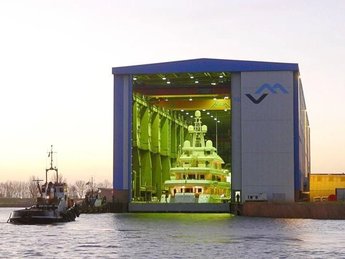 a container ship in the water aboard UTOPIA Yacht for Sale