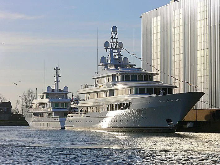 a couple of large boats in the water aboard UTOPIA Yacht for Sale