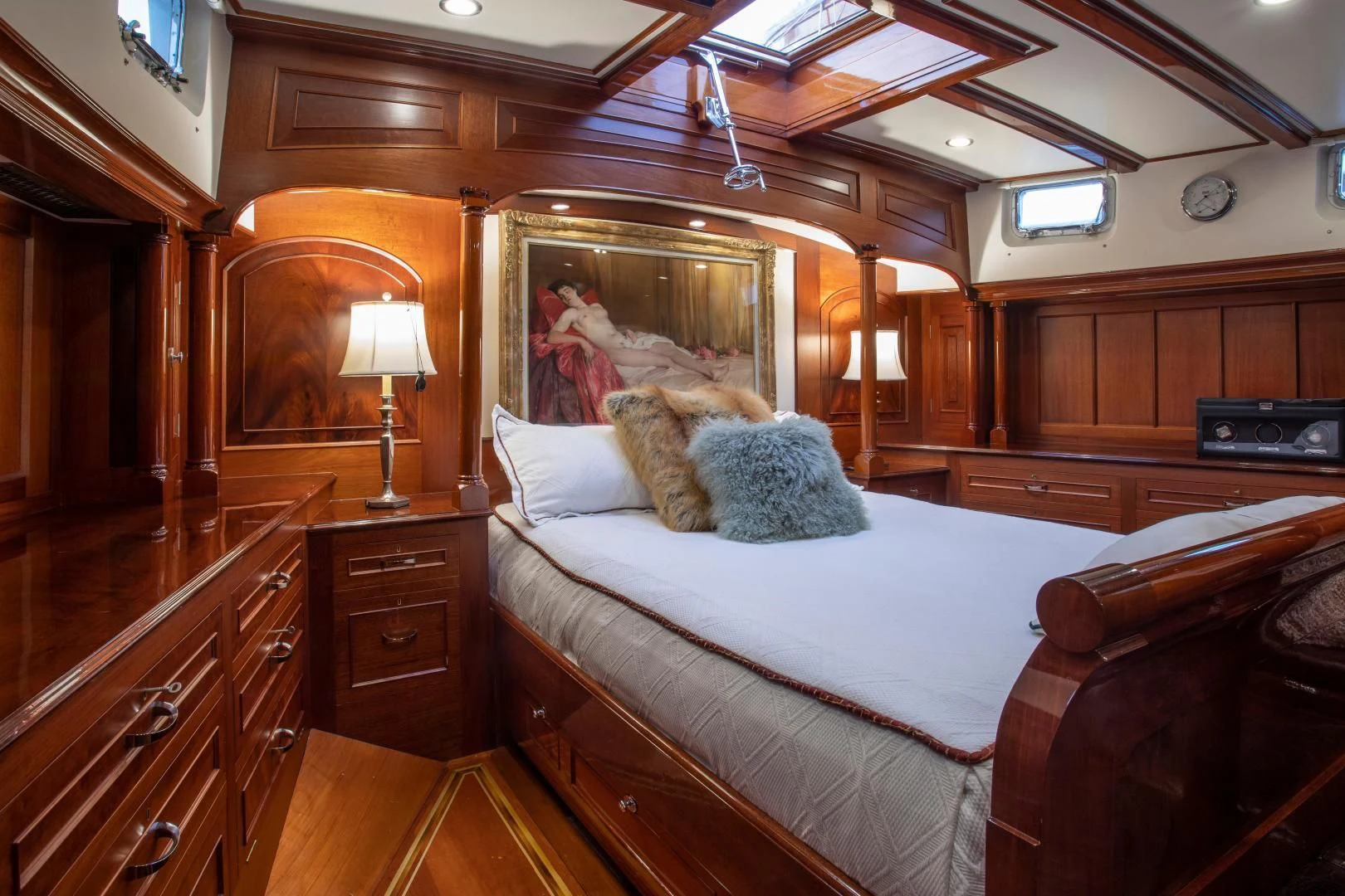 a bed with a white comforter aboard SEA DIAMOND Yacht for Sale