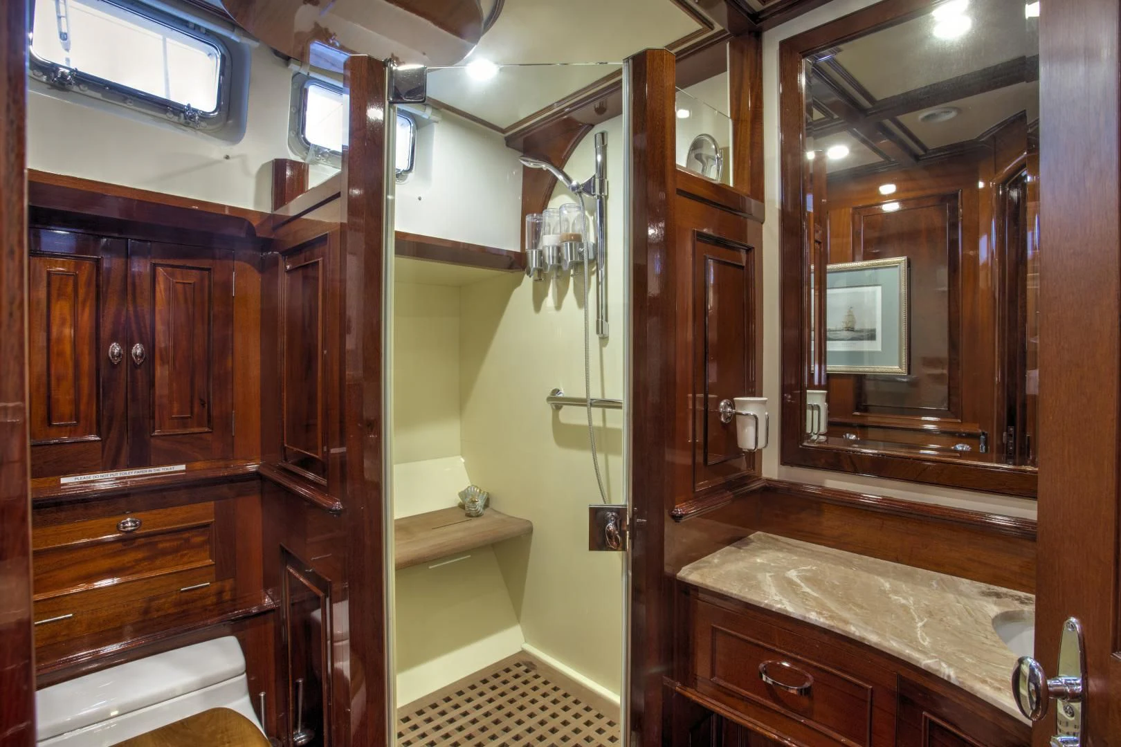a bathroom with a large mirror aboard SEA DIAMOND Yacht for Sale