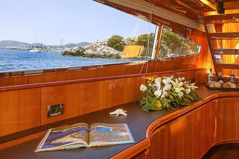 a room with a table and chairs aboard DAYPA Yacht for Sale