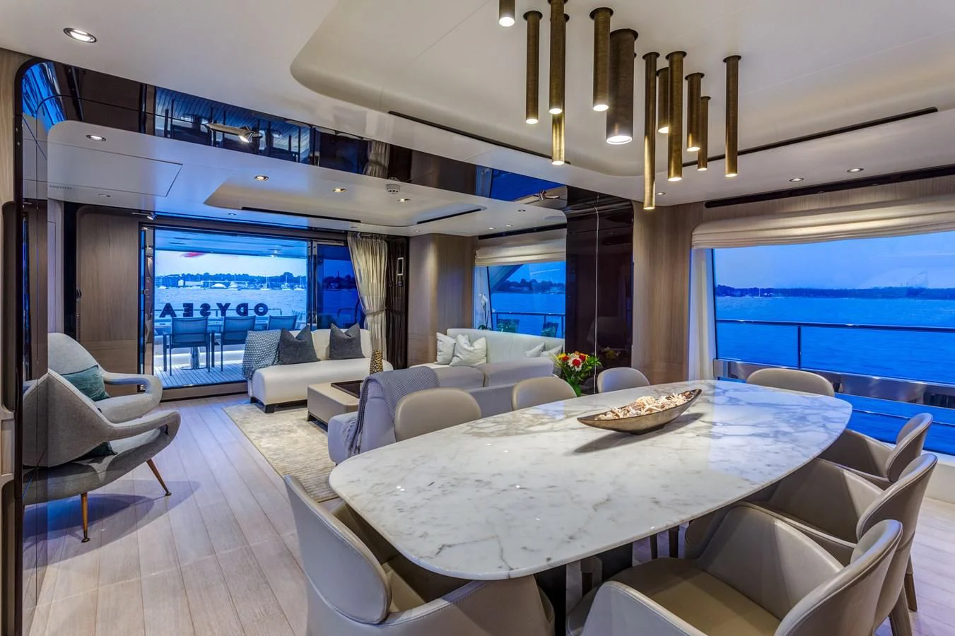 a large room with a table and chairs aboard CAPTAIN MORGAN II Yacht for Sale