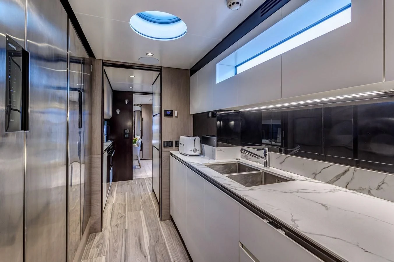 a kitchen with a large countertop aboard CAPTAIN MORGAN II Yacht for Sale