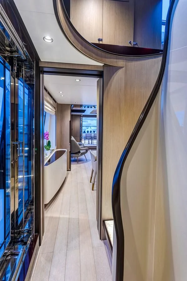 a hallway with chairs and a table aboard CAPTAIN MORGAN II Yacht for Sale
