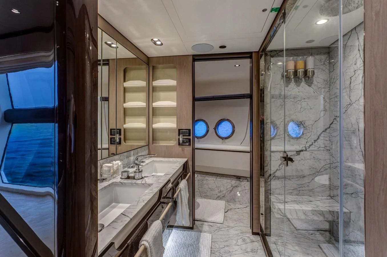 a bathroom with a shower unit and sinks aboard CAPTAIN MORGAN II Yacht for Sale