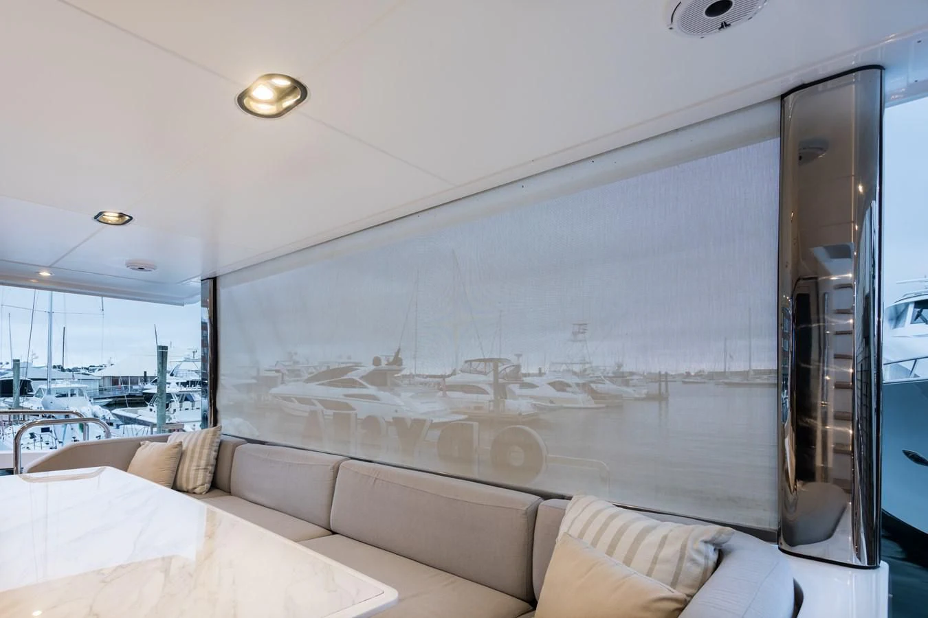 a room with a couch and a large window aboard CAPTAIN MORGAN II Yacht for Sale